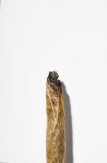 Cannabis cigarette on white background