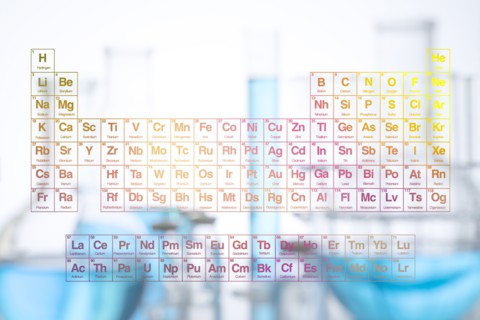 Digital composite with periodic table and laboratory glassware