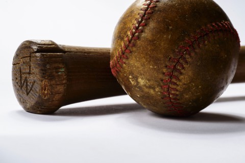 Studio shot of old baseball bat and ball