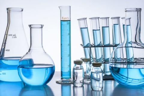 Laboratory glassware with blue liquid