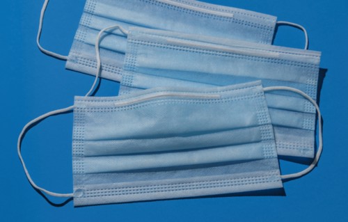 Studio shot of surgical masks on blue background