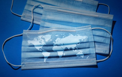 Studio shot of surgical masks with world map