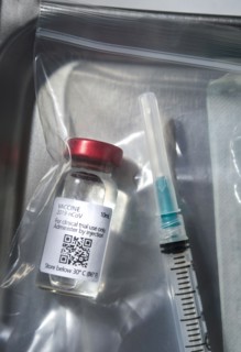 Covid-19 vaccine and syringe