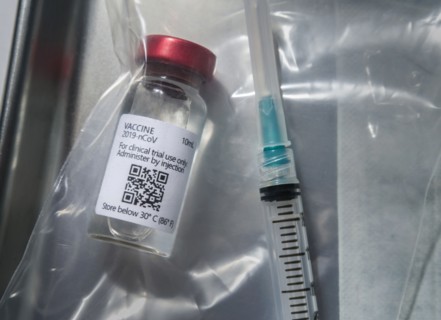 Covid-19 vaccine and syringe