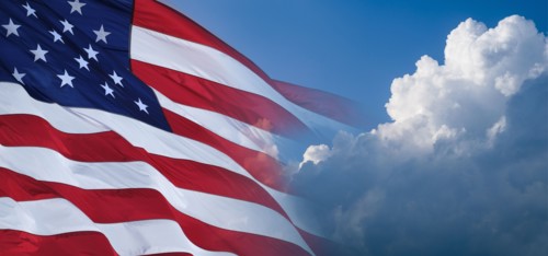 Digitally generated image of American flag and clouds