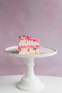 Slice of festive cake on cake stand