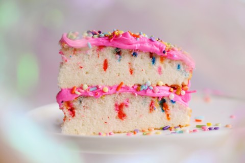 Slice of festive cake on cake stand