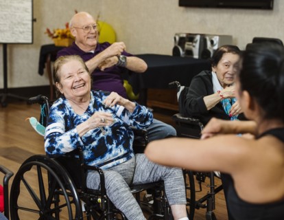 Senior people having fitness class with instructor