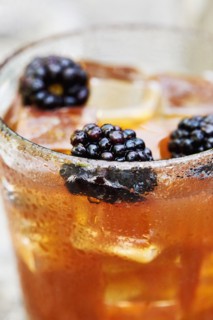 Blackberries in whiskey cocktail