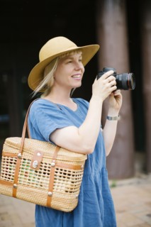 Woman holding digital camera