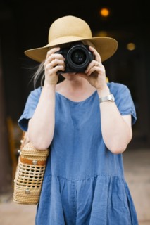 Woman photographing with digital camera