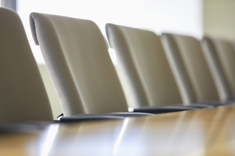 Office chairs in row at table