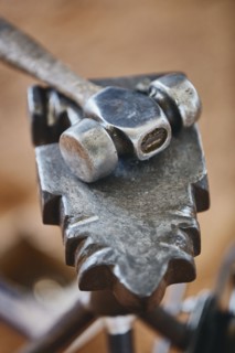 Close up of metal hammer and anvil