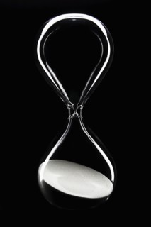 Hour glass on black background