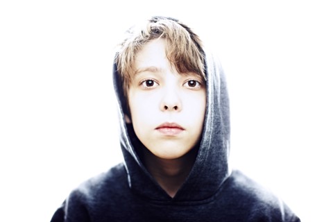 Portrait of young man in hood