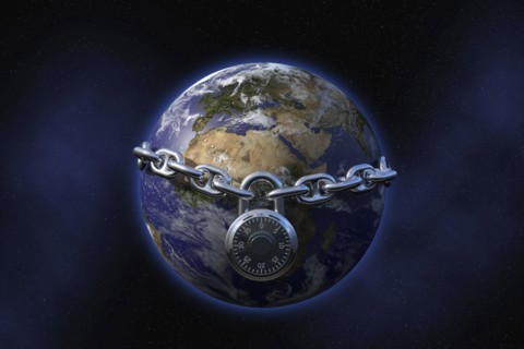 Padlock on chain surrounding globe in space