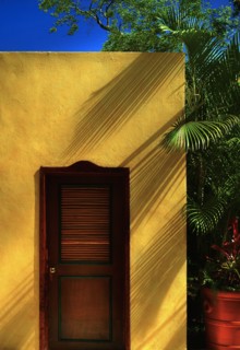 Morocco, Marrakesh, Wooden door in yellow building