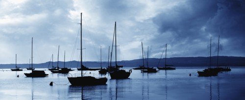 USA, Michigan, Sailboats in harbor at stormy day