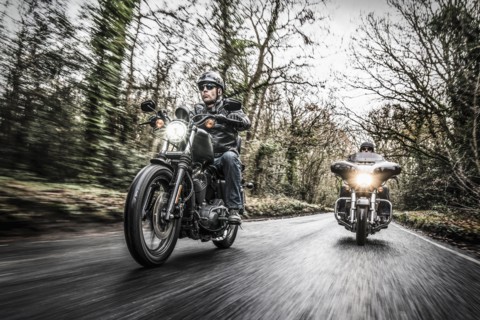 United Kingdom, London, Motorcyclists on road in forest