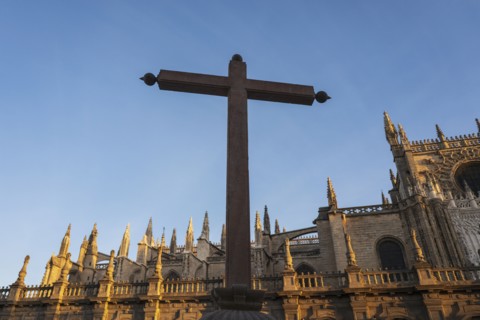 Spain, Seville, Cross against facade of Seville Cathedral