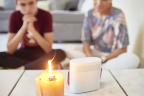 Family attending mass on cellphone