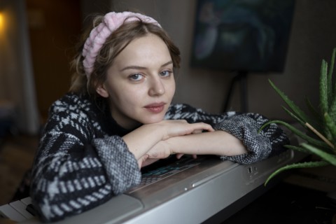 Portrait of mid adult woman at home