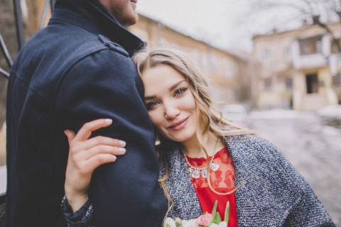 Newlywed couple embracing outdoors