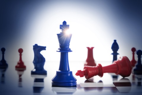 Studio shot of red and blue chess pawns symbolizing US Democratic and Republican parties