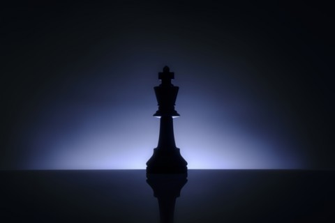Studio shot of blue chess king