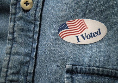 Close-up of I voted sticker on denim shirt