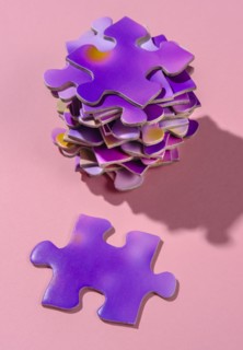 Stack of purple jigsaw puzzles
