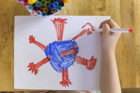 Girl (6-7) drawing coronavirus