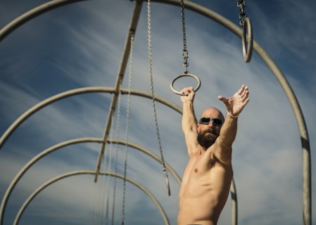 Man exercising on gymnastics rings