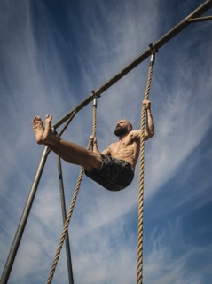 Man exercising on rope