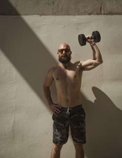 Man exercising with dumbbell