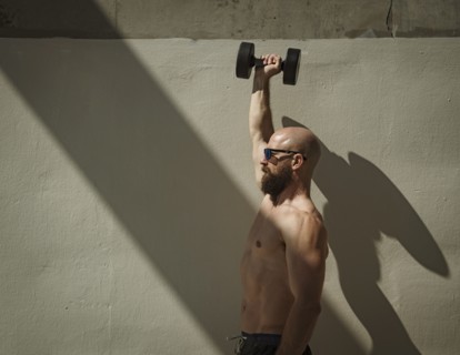 Man exercising with dumbbell