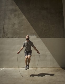 Man exercising with jumping rope