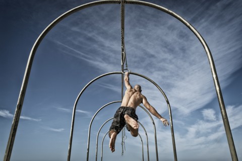 Man exercising on gymnastics rings