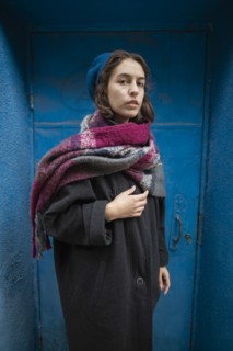 Portrait of young woman wearing coat, beret and scarf,