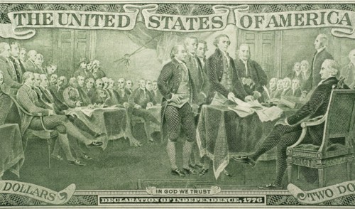US paper bill with declaration of independence scene