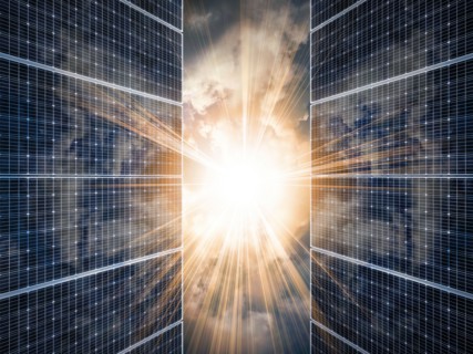 Sun shining through solar panels,,
