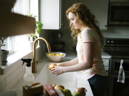 Woman washing onion