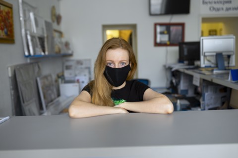 Portrait of woman wearing flu mask in office