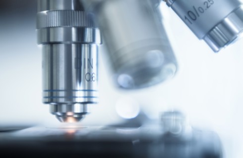 Close-up of laboratory microscope lens