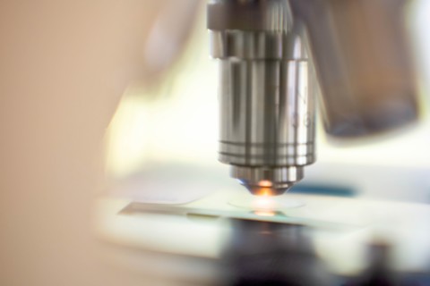 Close-up of laboratory microscope lens