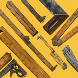 Graphic pattern of vintage rulers on yellow background