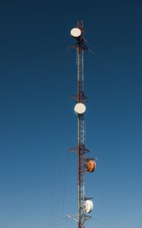 Communication tower against blue sky