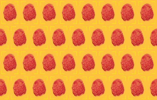 Red fingerprints on yellow background