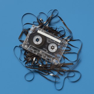 Analog audio cassette on blue background