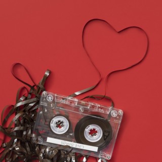 Analog audio cassette on red background